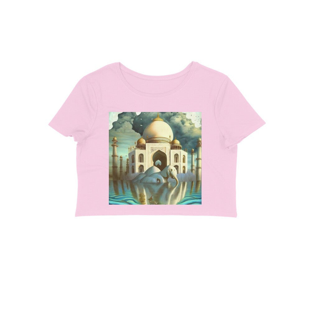 The Intelligentsia pink crop top with a surrealist Taj Mahal and elephant graphic. Features a white elephant resting in water before the iconic monument.